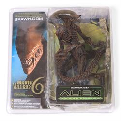 Three McFarlane Toys Movie Maniacs Alien and Predator action figures, comprising Alien Resurrection Warrior Alien, Predator 2 Predator the Hunter and Aliens Colonial Marine CPL Hicks, all carded