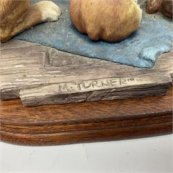 Three Border Fine Arts figures including Boxer with Pups, Capodimonte figure of a drunken pirate, and a brass dog (5)