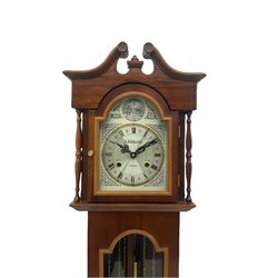 A contemporary “Lawrain” Grandmother clock in a simulated mahogany case, with a two-train spring driven month going movement, fully glazed door displaying dummy weights and pendulum, brass break arch dial with etched decoration and chapter ring. Striking the hours and half hours on a gong.


