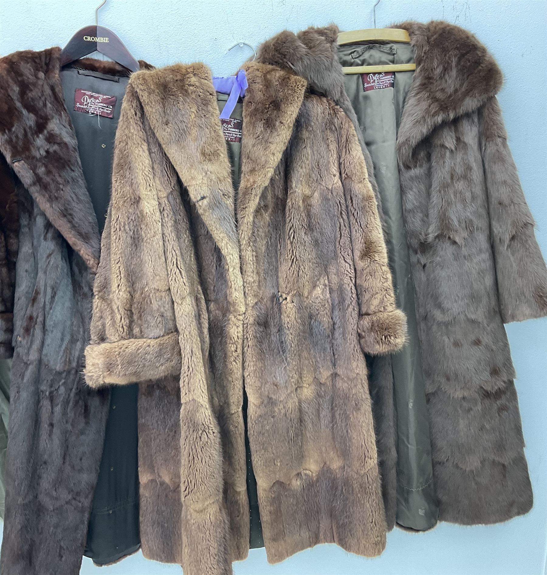 Four ladies three quarter length fur coats, by Dysons Furriers Ltd, Commercial St, Leeds, comprising of a light brown mink fur coat, two dark brown mink fur coats and another brown fur coat.  