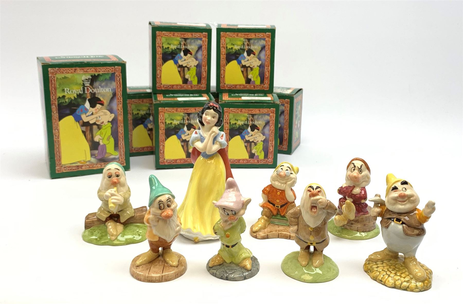 Royal Doulton Snow White and the Seven Dwarfs figurines, each with box. (8). 