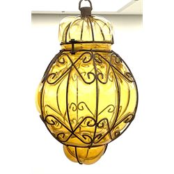 Continental ceiling light amber glass encased in an iron frame 38cm. 