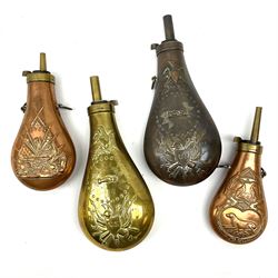Four copper/brass graduated powder flasks, three with American style embossed decoration and the other decorated with game and hunting dogs, largest H22cm (4)