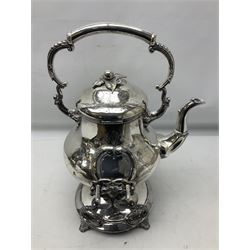 Victorian silver plated tea kettle of baluster form on stand, the bulbous body with floral and foliate decoration and two vacant reserves, foliate scroll handle and domed cover, raised upon the foliate stand and burner, H41cm