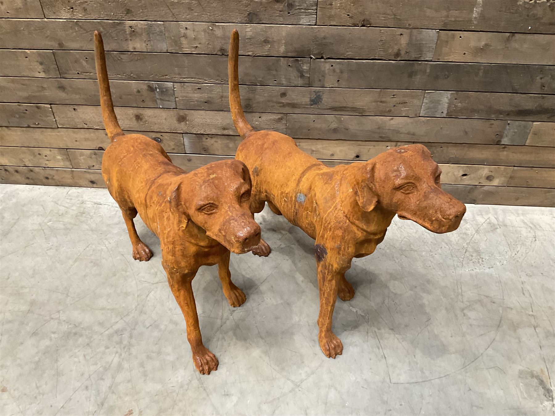 Pair of life-size heavy cast iron garden Hunting dogs