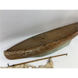 Early 20th century large pitch pine pond yacht hull painted light blue and white with lead keel and simulated planked deck L102cm; together with a two-piece wooden mast and sails
