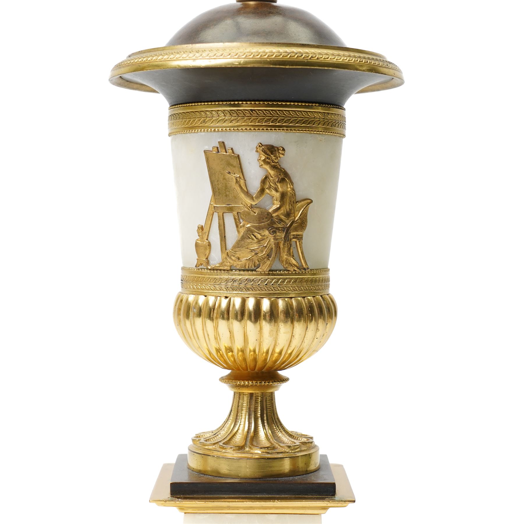 Pair of early 20th-century Neoclassical lamp bases in gilt bronze and alabaster, each decorated with classical figural reliefs celebrating the arts, each of baluster form, the alabaster bodies applied with finely cast gilt-bronze scenes including a seated painter at an easel, a sculptor at work, and allegorical female figures with musical  and theatrical motifs, mounted on square alabaster plinths with gilt-bronze borders and raised on bun feet, the domed shoulders enriched with laurel-leaf mouldings, H42cm 