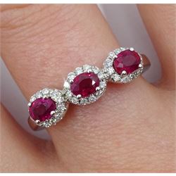 White gold three stone oval ruby and round brilliant cut diamond cluster ring, hallmarked