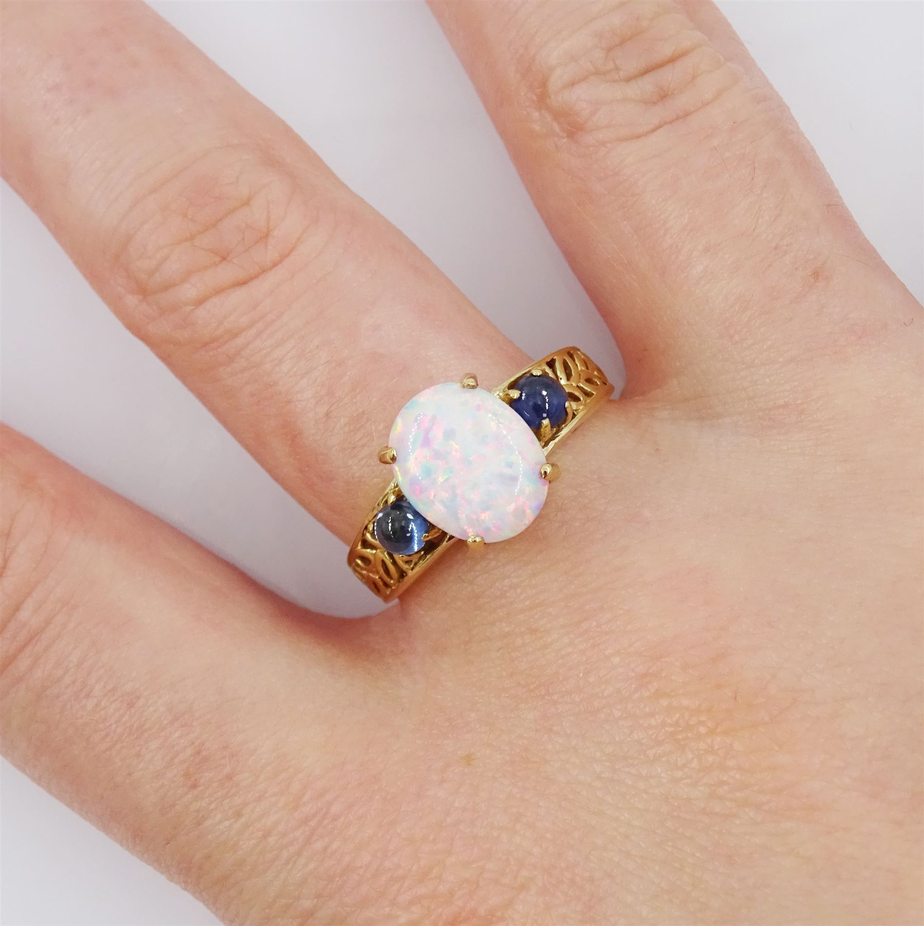 9ct gold three stone opal and sapphire ring, hallmarked