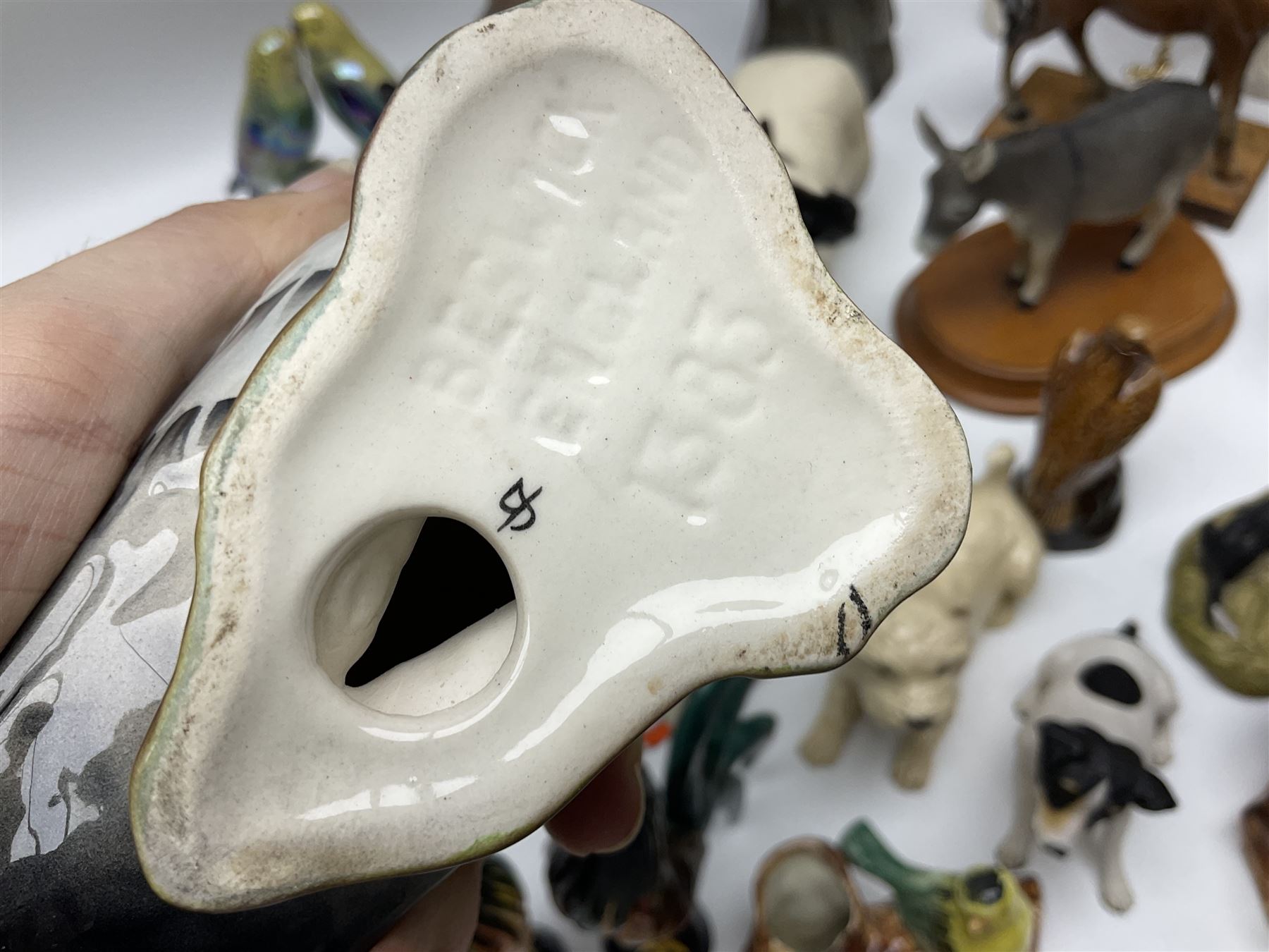 Beswick pigeon no 1383 and a collection of other ceramic animal figures including Campsie Ware lustre budgies, Kowa red fox and Labrador, two shire ponies, two sheep, etc 