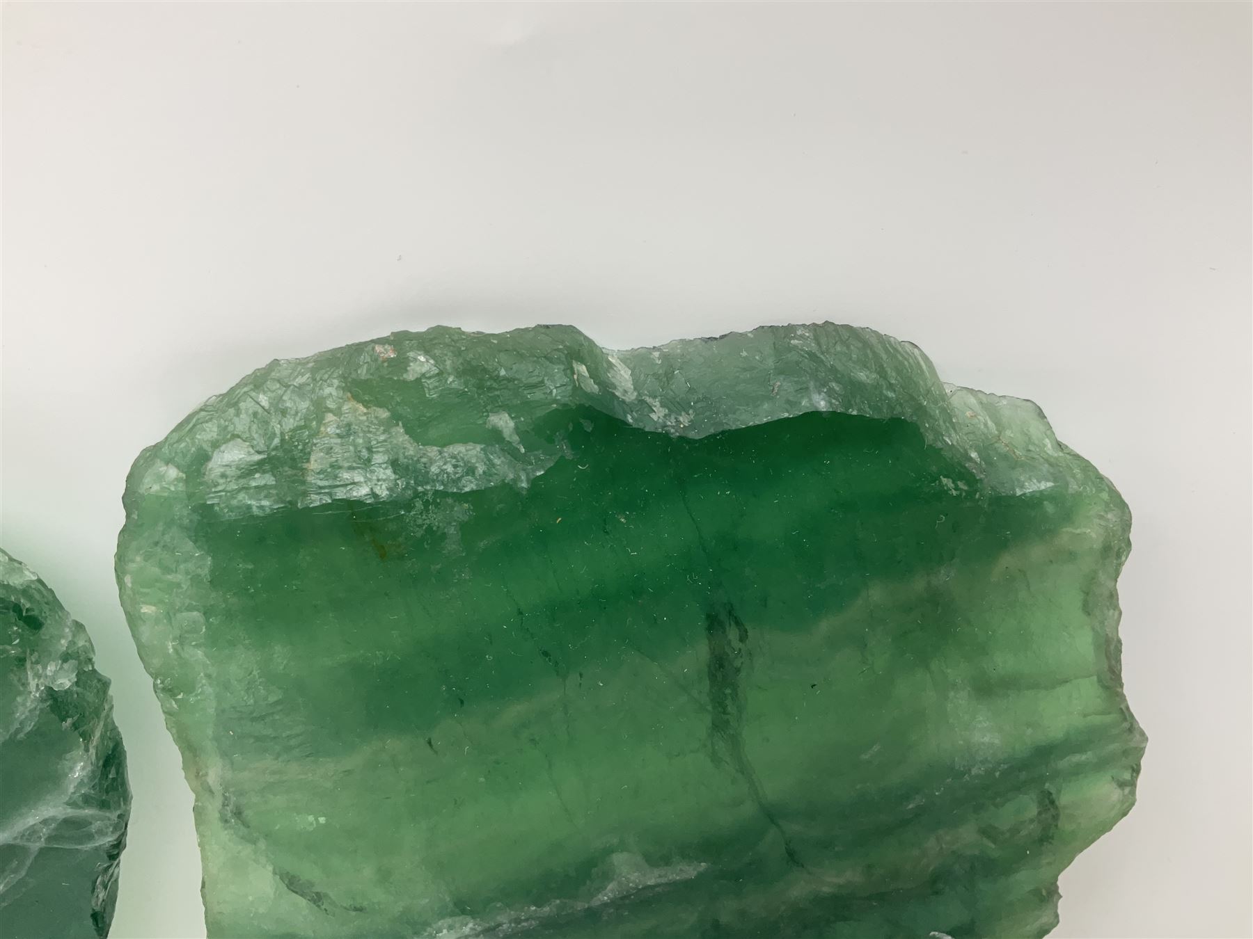 Pair of green fluorite slices, polished with rough edges, H16cm, L17cm  