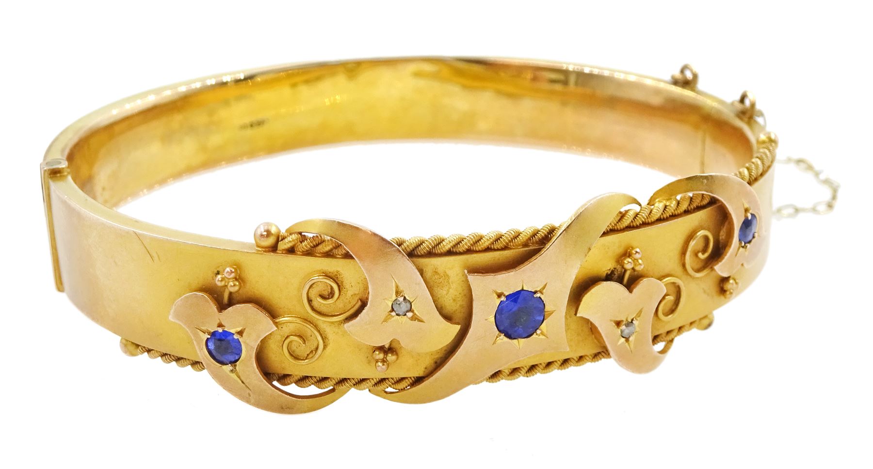 Edwardian 9ct gold blue stone and diamond chip hinged bangle, Chester 1909