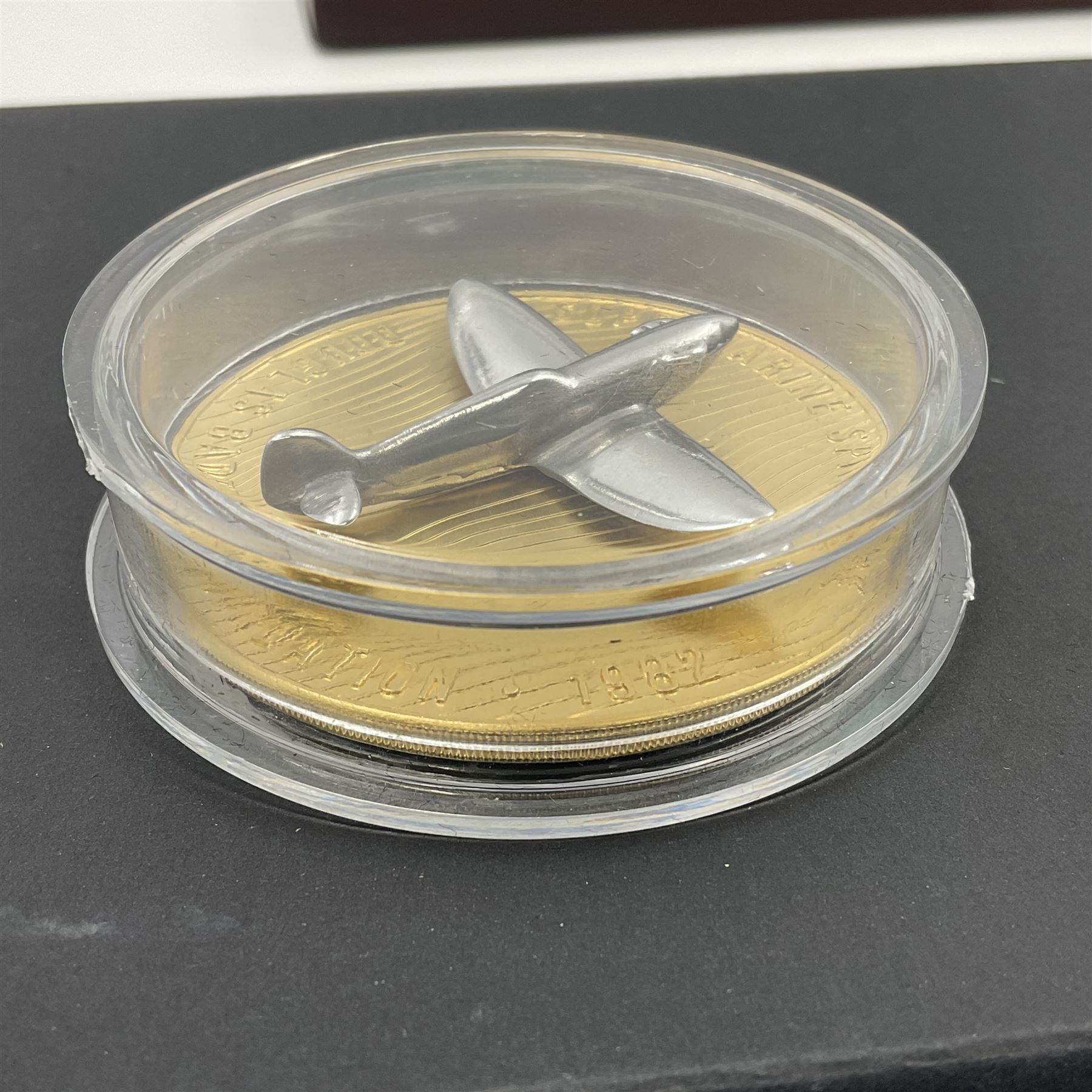 Group Captain Sir Douglas Bader gold spitfire commemorative, 9ct gold medallion mounted with a model of a Spitfire made from aluminium from AB910, gross weight 62 grams, cased with certificate