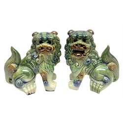 Pair of Chinese stoneware Fo dogs with merging green, brown and blue glaze, H22cm