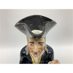 Early 20th century Staffordshire William Kent Squire toby jug, modelled seated upon a corner chair holding a jug of ale in his right hand, H28cm