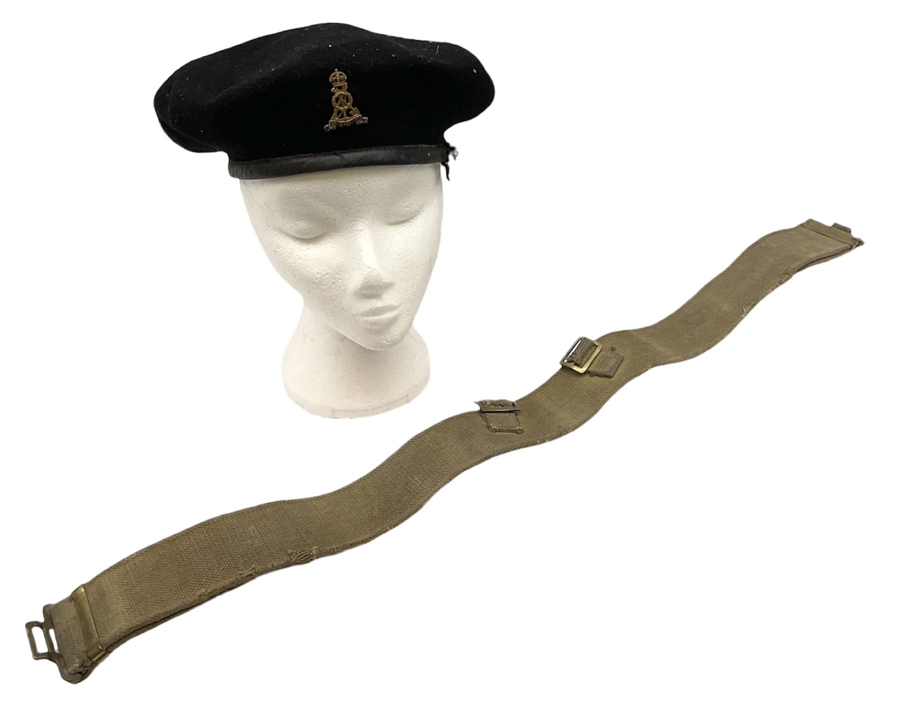 WW2 British black felt beret with Pioneer Corps cap badge, with Kangol Wear maker's mark dated 1943; and a British Army green webbing belt (2)