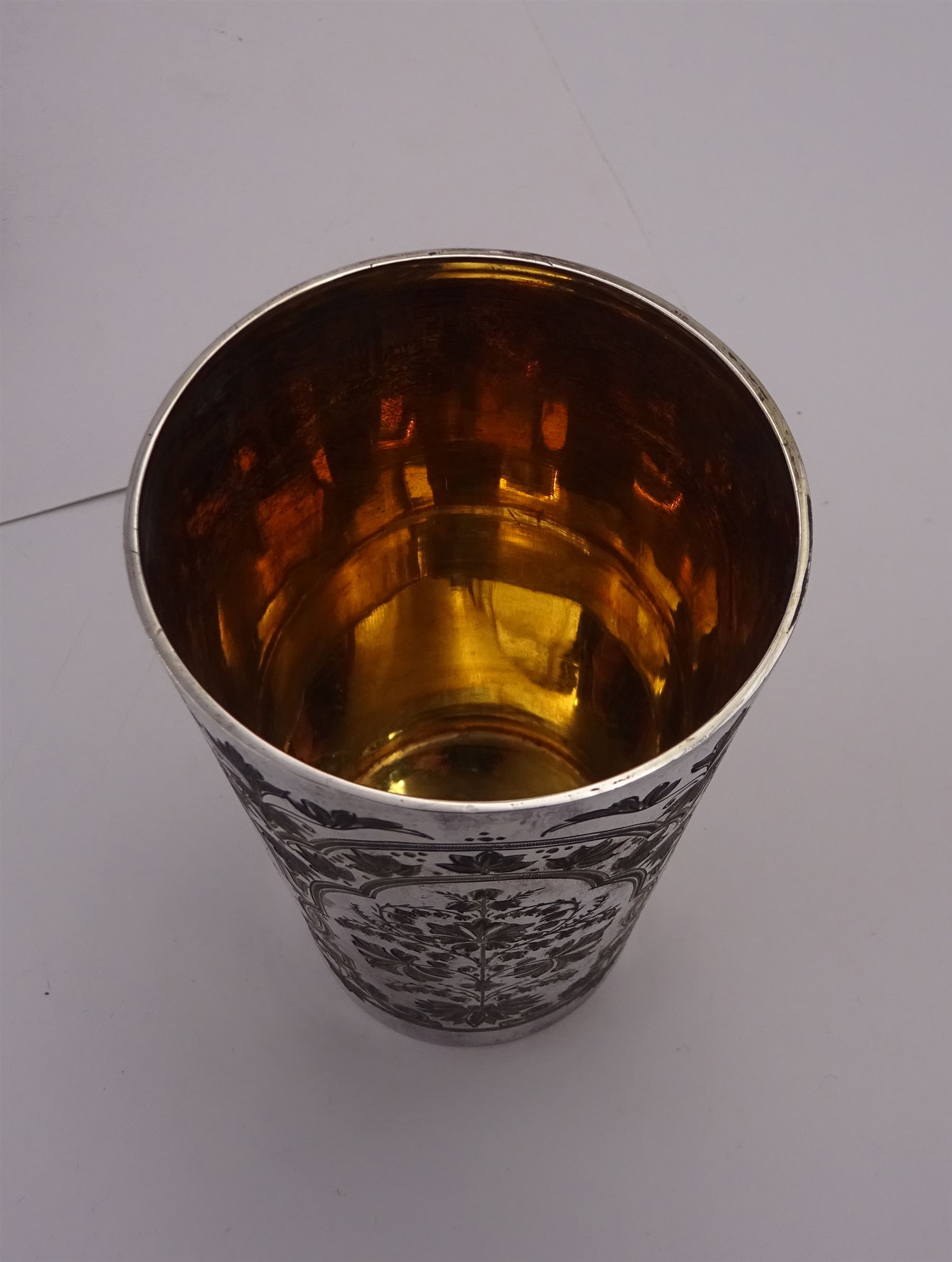 Victorian silver four piece christening set, comprising a beaker mug, napkin ring, fork and spoon, with bright cut floral decoration and monogrammed initials to each item, mug hallmarked Mappin & Webb (John Newton Mappin), Sheffield 1884, within tooled leather fitted case