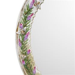 Sitzendorf oval table mirror with two cherubs holding a floral garland above foliage and insects etc on easel stand 40cm x 31cm