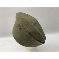 Five reproduction German WW2 hats comprising Wehrmacht olive tropical helmet, Heer officer's peaked cap, two M43 caps and Field side cap (5)