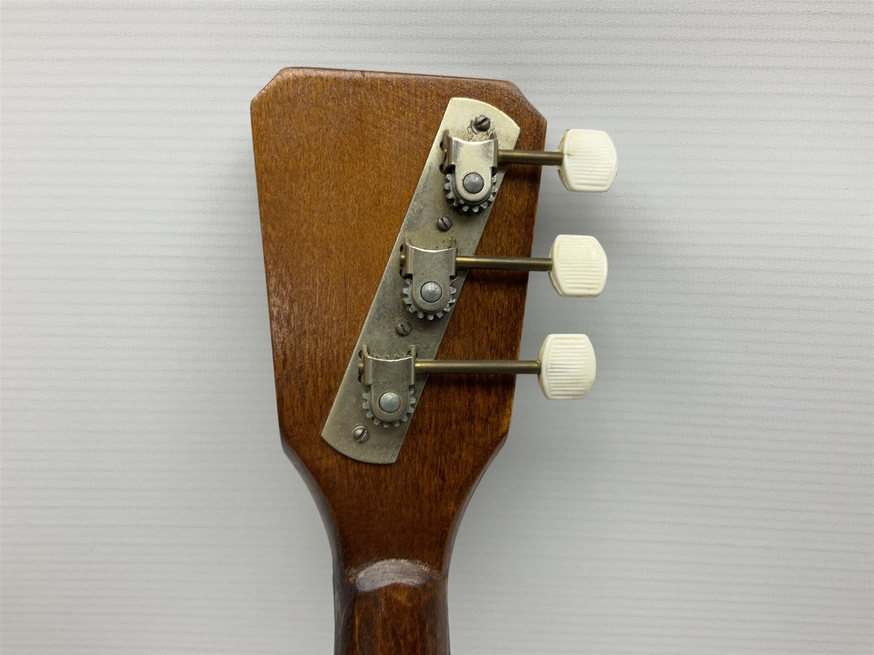 Russian balalaika with six-piece segmented back, the top painted with a scene of Russian onion capped buildings monogrammed K.B.H.1993; bears cyrillic label; L67.5cm; in carrying bag