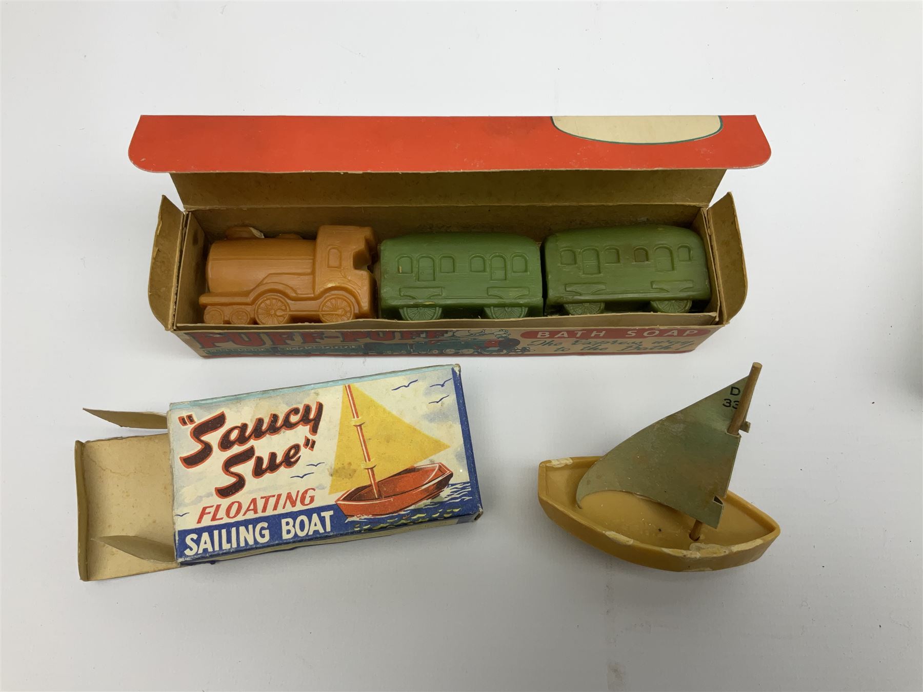 Five novelty soap, comprising Archie Andrews, Three Bonzos, Saucy Sue, Puff Puff bath soap, Festival of Britain 1951, together with pocket wonder library books