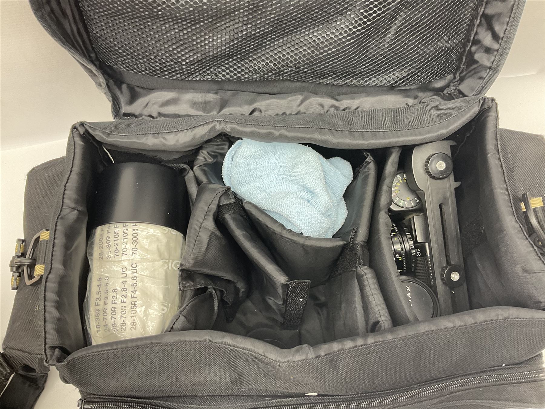 Four camera bodies, to include, Ricoh KR-10 serial no. 38826, Pentax MZ-M serial no. 4185969 with 'SMC Pentax- M 1:3.5 28mm' lens, Canon EOS500 serial no. 080927, with 'Sigma Zoom 100-300mm 1:4.5-6.7 DL'  lens etc, with other camera lenses and equipment 