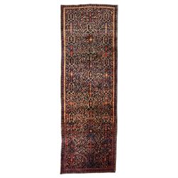 Large Persian indigo ground Herati runner rug, the busy field decorated with repeating geo...