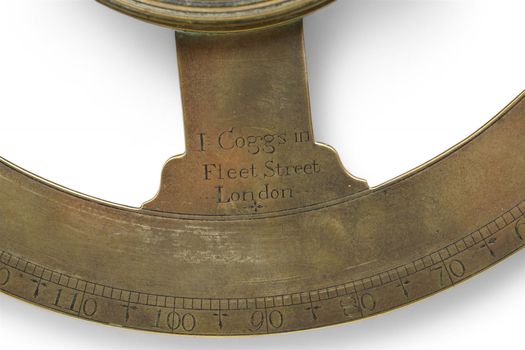 Ihon (John) Coggs of Fleet Street, London,- George II brass circumferentor (theodolite) c1730, housing a cylindrical glazed compass with a steel  indicating hand and engraved (formerly silvered) eight point compass rose to the centre, outer track divided into two-degree intervals and a subsidiary Arabic numeral chapter ring divided into ten minute intervals, mounted on a 12