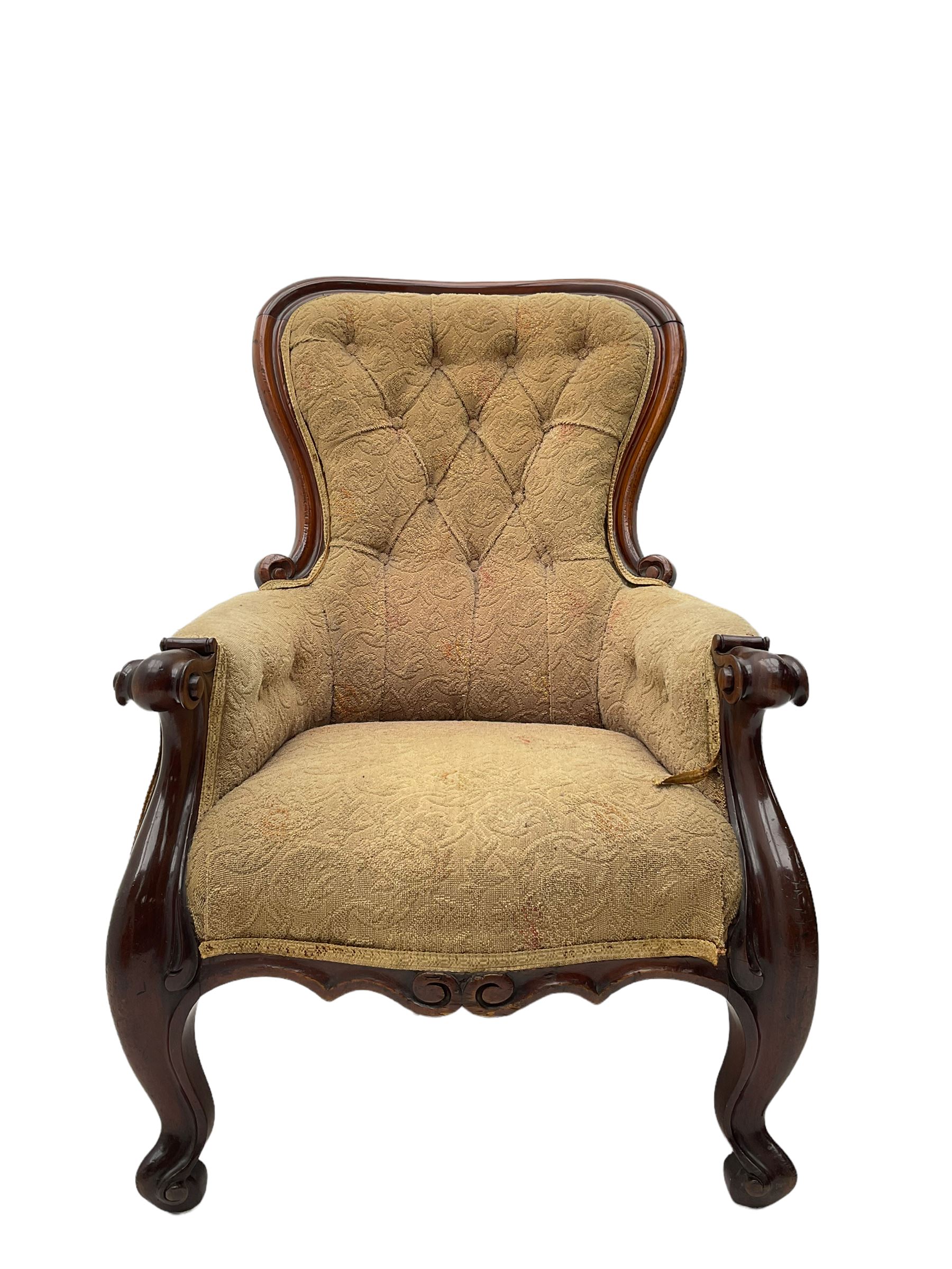 Victorian mahogany upholstered armchair, moulded framed, scroll carved arm terminals on scrolled cabriole supports, shaped carved apron
