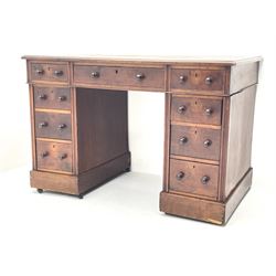 Late Victorian walnut twin pedestal desk of small proportions, rectangular moulded top with leather inset, fitted with nine drawers, plinth base