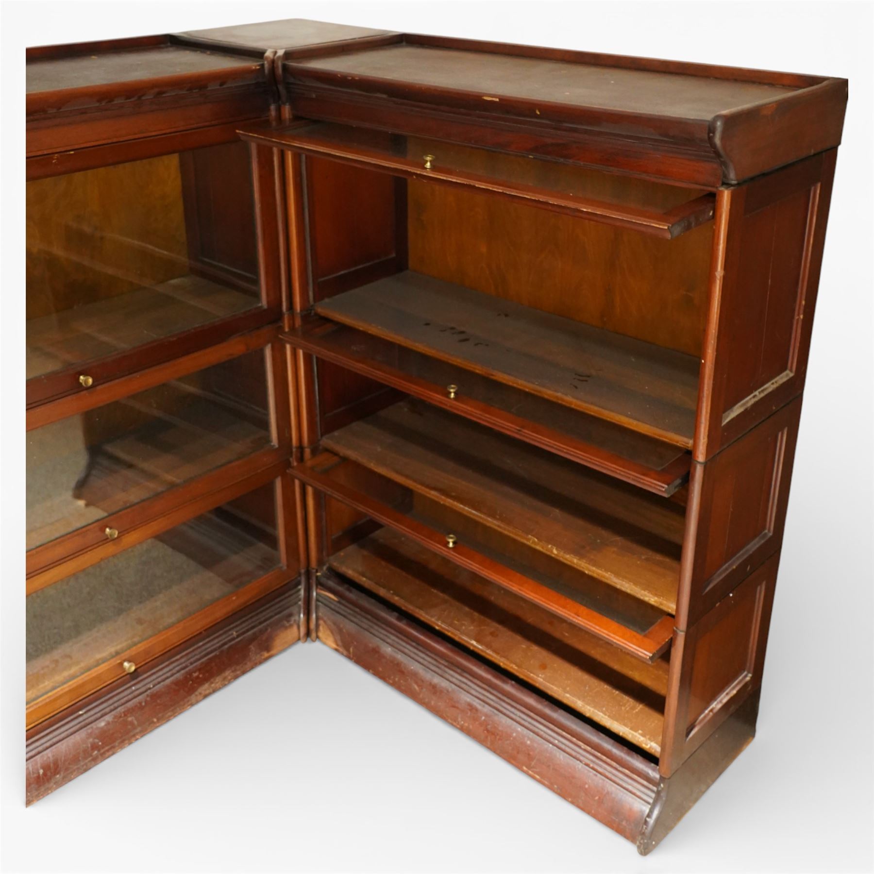 Globe Wernicke - early 20th century corner bookcase, comprising six sections, panelled sides raised on a moulded plinth base  