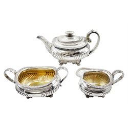 George III three piece silver tea set, baluster design with ribbed lower section raised on cast acanthus leaf and paw feet London 1815, 36oz 