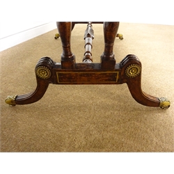  Regency gilt metal mounted brass strung rosewood and simulated rosewood Sofa table, with two fall leaves, two real and two false cockbeaded frieze drawers with brass ring handles on twin turned end supports joined by a stretcher on reeded cabriole legs with brass sockets and castors, L160cm, W74cm, H77cm max  