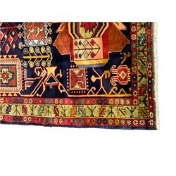 North West Persian Heriz Kelleh rug, the blue ground field with large stylised plant medallions, decorated with flower head, bird and tree of life motifs, triple band foliate pattern borders 