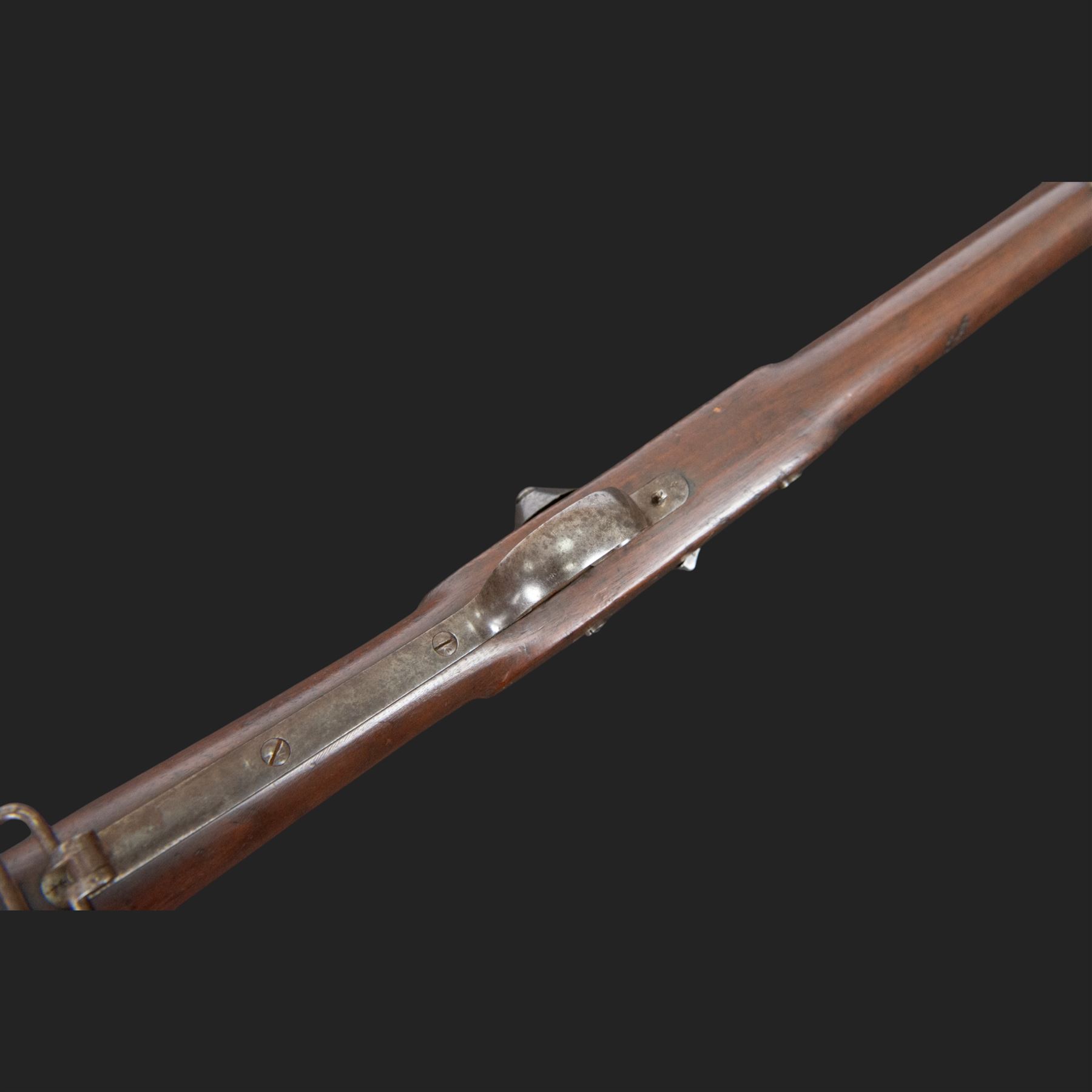 Snider-Enfield service rifle .577 calibre, barrel 33 in., tangent/ladder back sight, action marked with crowned V.R BSA & Co 1872, full stocked with two barrel bands, steel clearing rod, walnut stock marked Mx1 93 Birmingham, overall L124cm