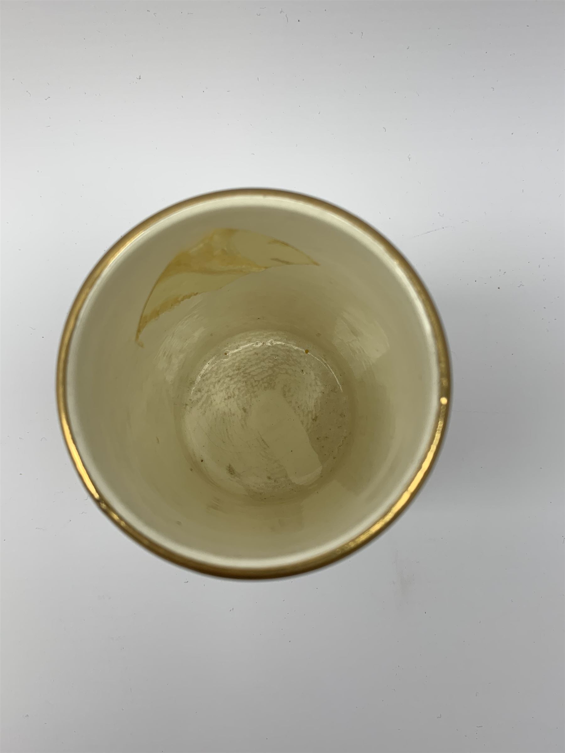 A Crown Devon Fieldings vase, of cylindrical form painted with a highland cattle scene and signed Cox, with printed marks beneath, H11.5cm