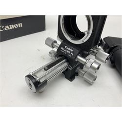 Collection of Canon lenses, to include 'Canon Lens FD 100mm 1:2.8', serial no 12821, 'Canon Lens FD 200mm 1:4' serial no 245313, 'Macro Canon Lens FL 50mm 1:3.5', serial no. 25505, 'Canon Lens FD 135mm 1:3.5 etc, together with other Canon equipment, including Bellows FL, Slide Duplicator etc 