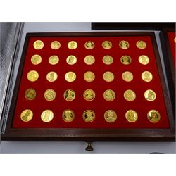 Danbury Mint, Our Royal Sovereigns Collection, seventy 22 carat gold plated silver medallions depicting the complete line of British monarchs to mark the 1200th anniversary of the first coronation, contained within wooden table top collectors cabinet with two drawers, with certificate of authenticity, with two drawers, hallmarked Danbury Mint, London various dates