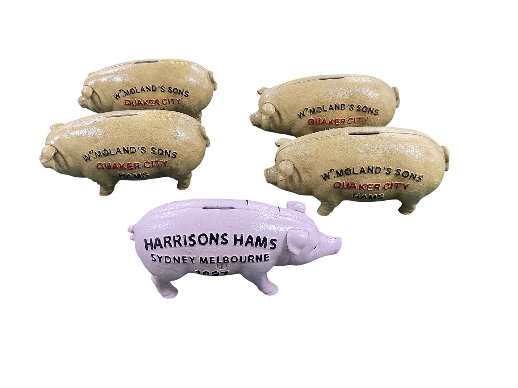 Four Cast iron Quaker City hams pig money boxes and one Harrisons ham money box, H9cm