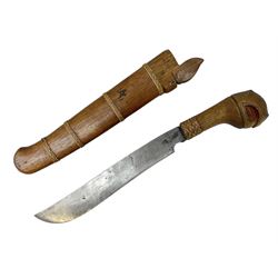 Malayan Parang the 29cm steel blade with two character marks and wicker bound hardwood hilt carved with a stylised parrot head; in wicker bound hardwood scabbard L43cm overall