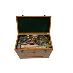 A lockable 8 drawer wooden tool box complete with miscellaneous workshop, engineering hand tools and machine tools, clockmaking tools, dividing plates, gauges, drills, callipers, screwdrivers, pliers, cutters etc.