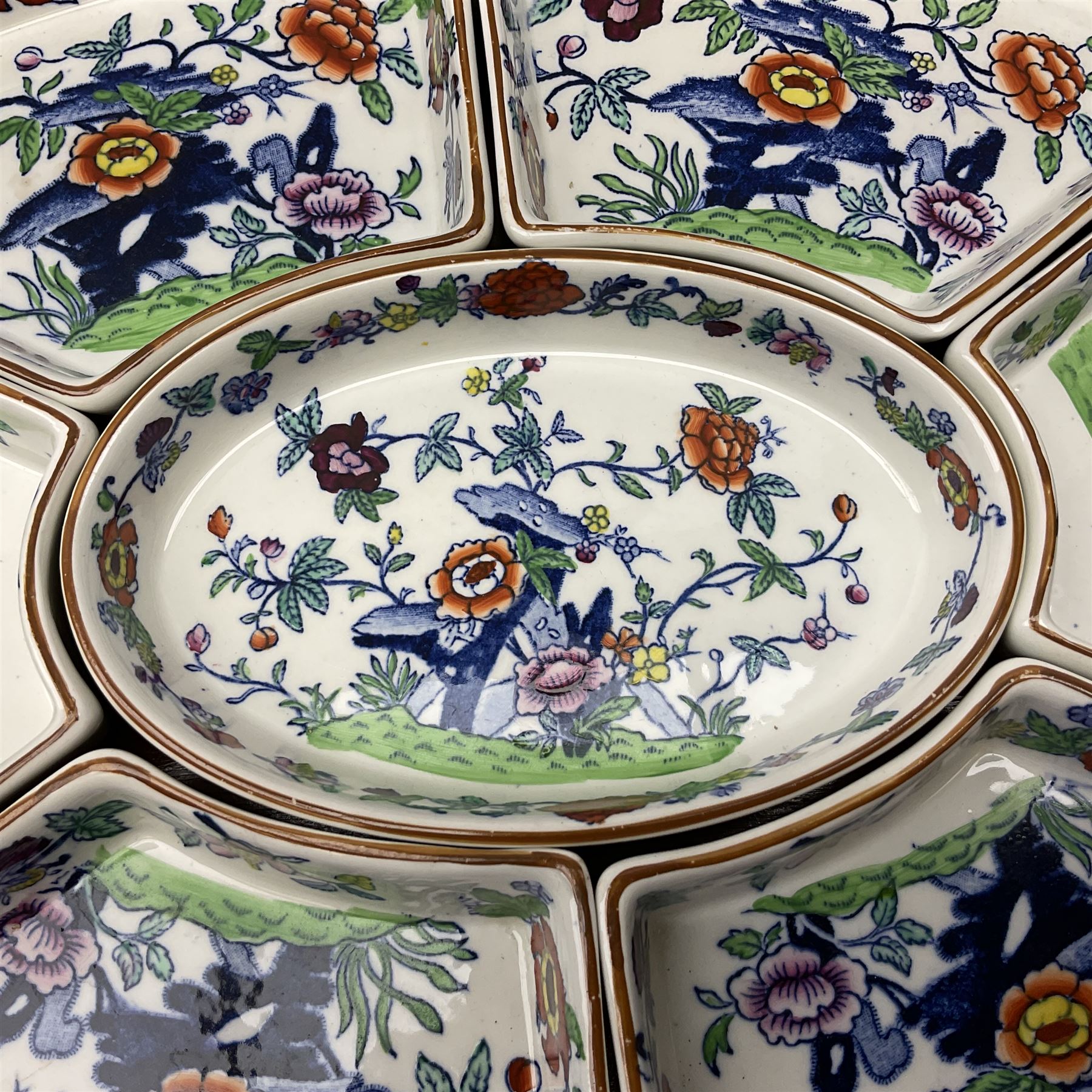 Booths Hors d'Oeuvres or supper set decorated in the Pompadour pattern, comprising seven dishes upon wooden tray L42.5cm, together with a bowl, D11.5cm, and six side plates, D19cm. 