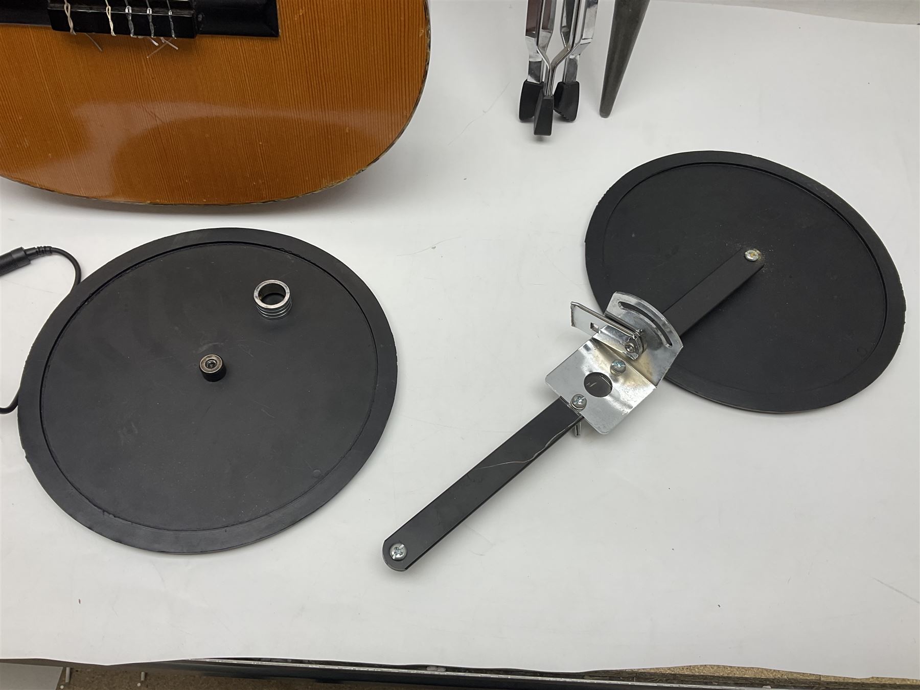 Spanish BM acoustic guitar with mahogany back and sides and spruce top L101cm; in cello carrying case; Roland foot pedal and two Yamaha foot pedals; tin D# organ pipe; folding music stand etc