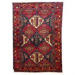 North West Persian Heriz hand-knotted rug, madder red field with an all-over lattice of st...