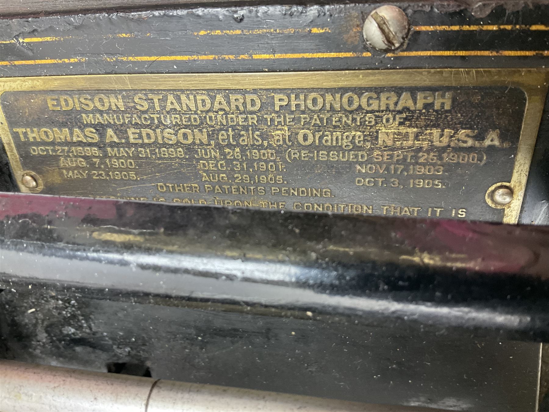 Edison Standard Phonograph with oak base (no cover), the reproducer marked 'Model C', serial no. 634857, last patent date Oct.1905, with black japanned conical horn L33cm; together with five cylinders