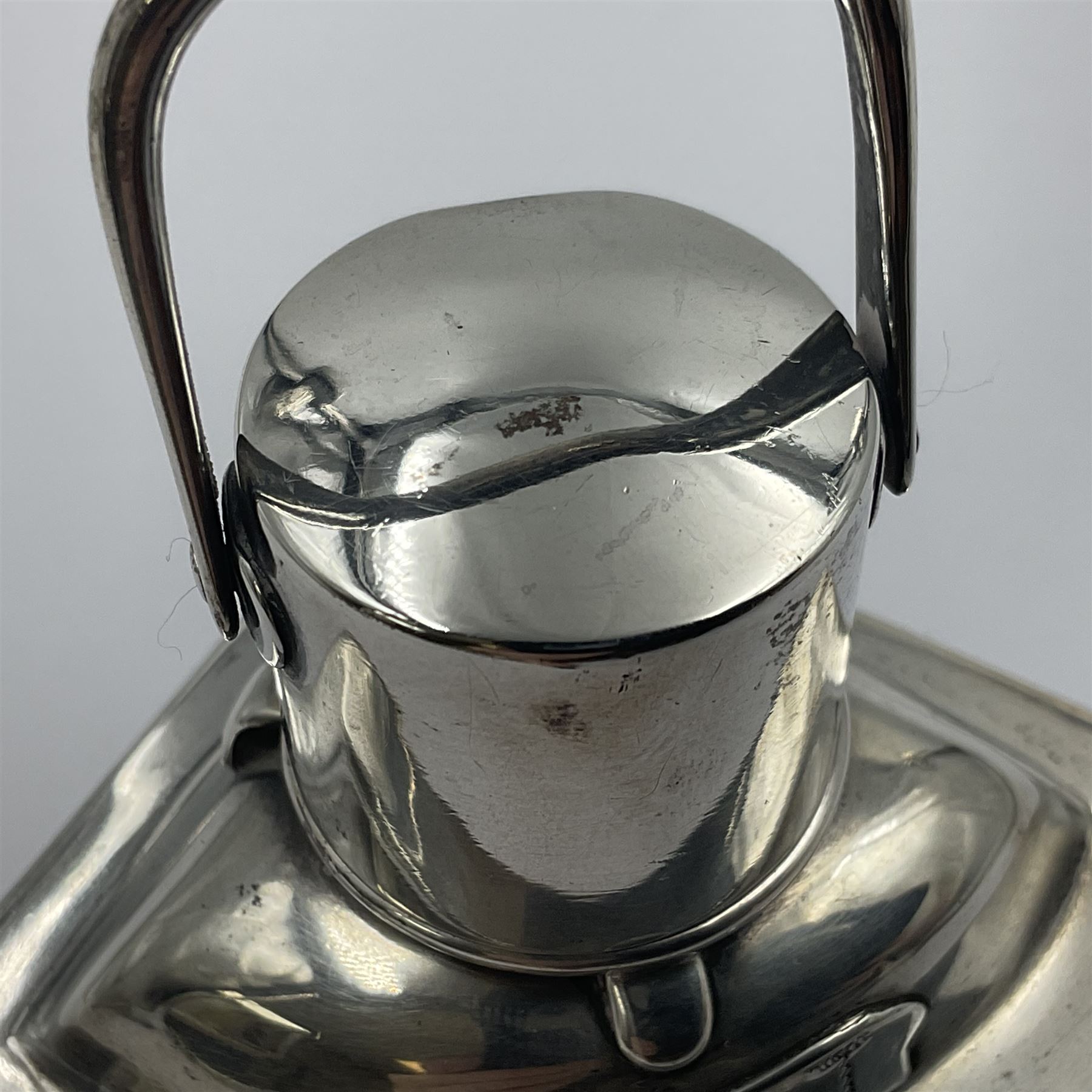 Early 20th century silver novelty inkwell, modelled as a ship's port lantern, with swing handle, convex red glass panel and hinged cover opening to reveal a glass liner, hallmarked Samuel Jacob, London 1911, height not including handle H8.5cm