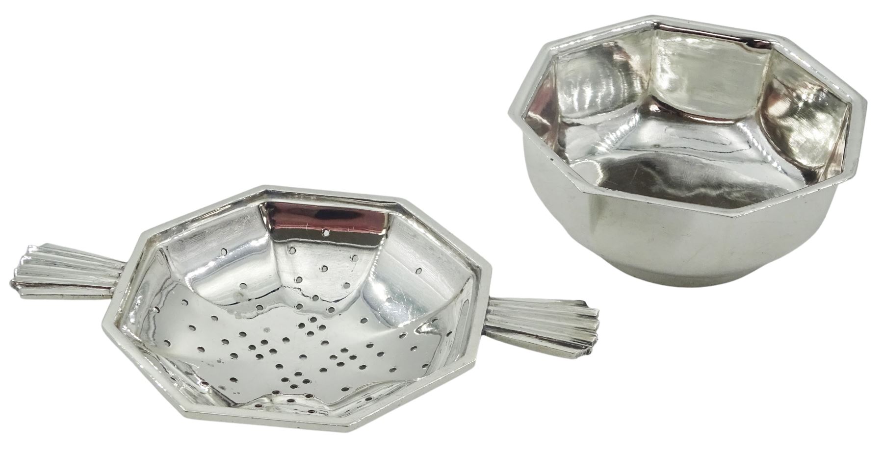 Mid 20th century silver tea strainer and bowl, each of octagonal form