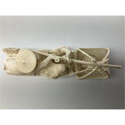 Japanese Tokyo School one piece ivory okimono, 19th century, carved as two fisherman with a net, H6cm, L15.5cm