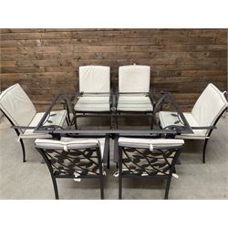 Metal framed garden table with glazed top (W170cm, D102cm, H71cm) and six armchairs with cushions 
