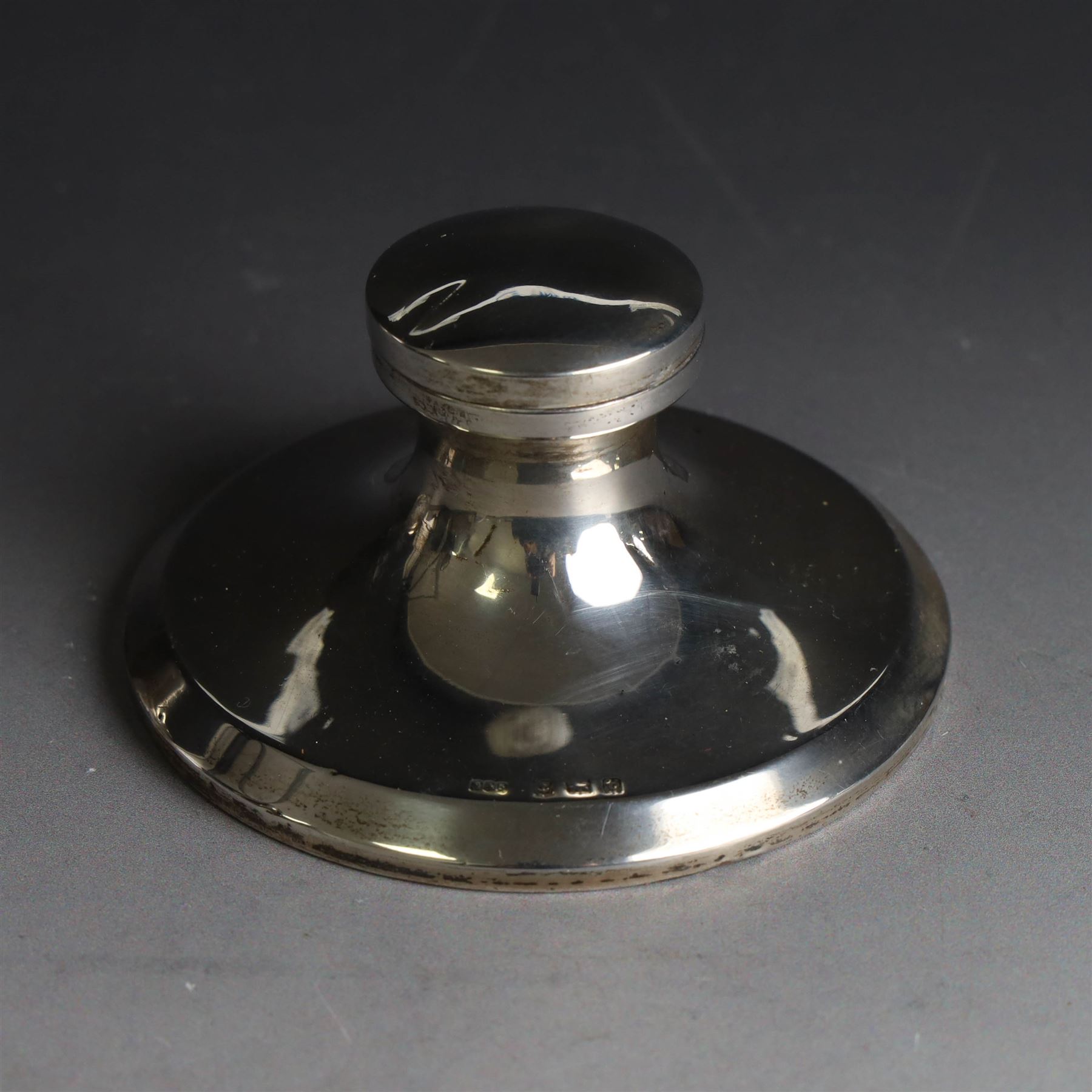 Edwardian silver fall-front ring box with loop handle, opening to reveal velvet interior with five ring spaces, hallmarked Deakin & Francis, Birmingham 1907, together with a cut glass jar with silver lid inscribed 'Hair Tidy' and a silver mounted capstan inkwell, both hallmarked 